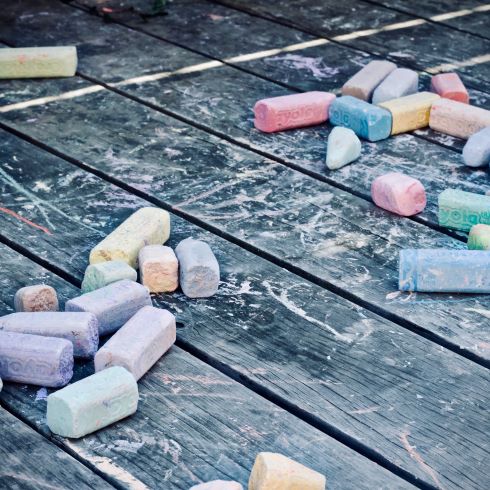 Colourful chalk laying on the floor