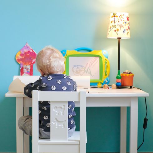 Child playing at a desk
