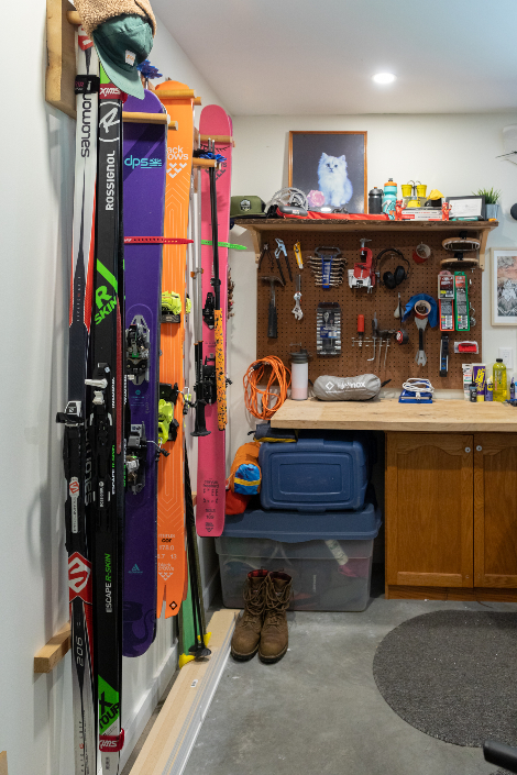 A utility area with storage for skis and other sporting equipment