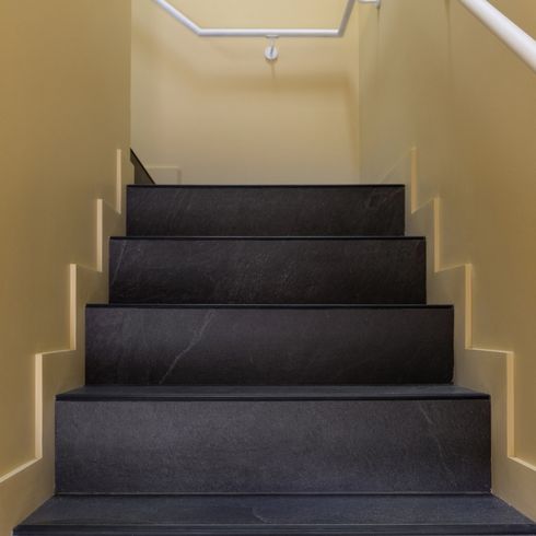 Black staircase in Toronto laneway house