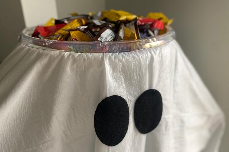 Halloween stand filled with candy 