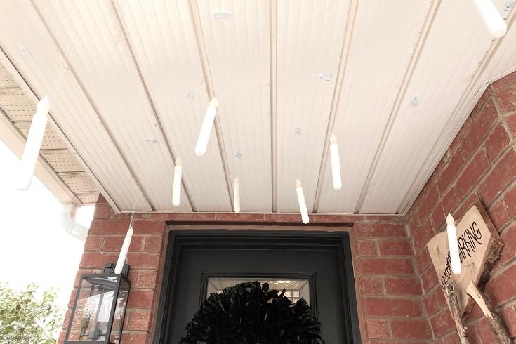 Floating candles on a porch 