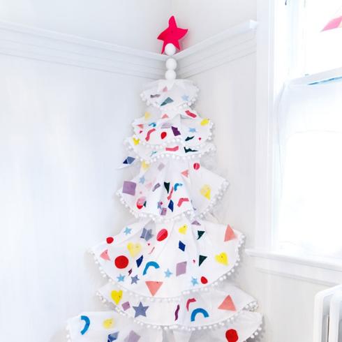 A white DIY Christmas tree made out of paper.