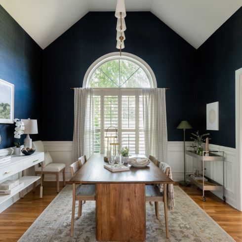 Dining room with bold dark blue walls