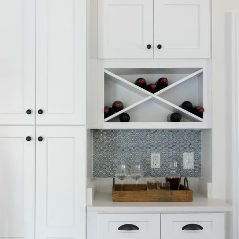 All-white cabinets with dark hardware