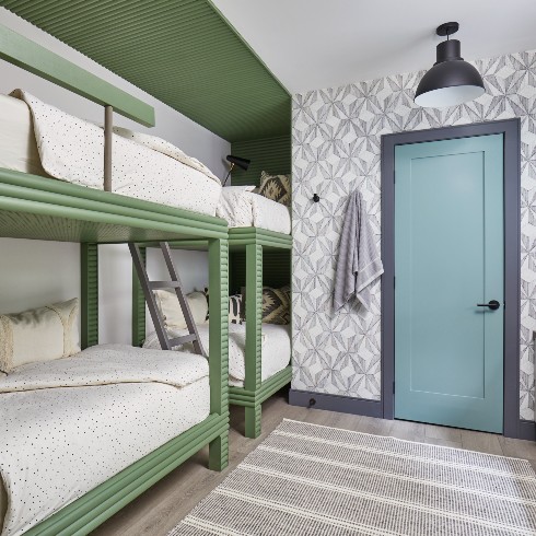 Green bunk beds in colourful kids bedroom