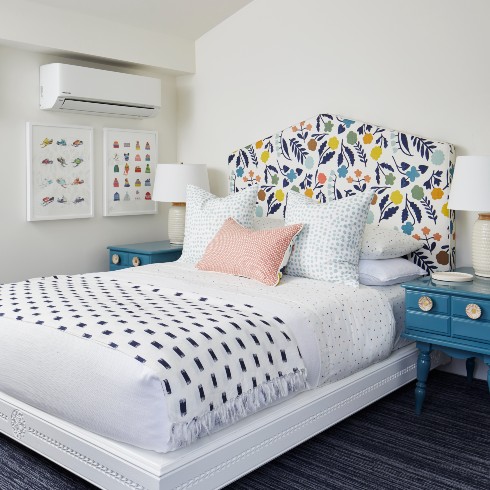 White bedroom with colourful accents