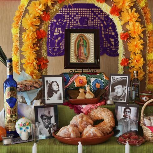 day of the dead altar with photos