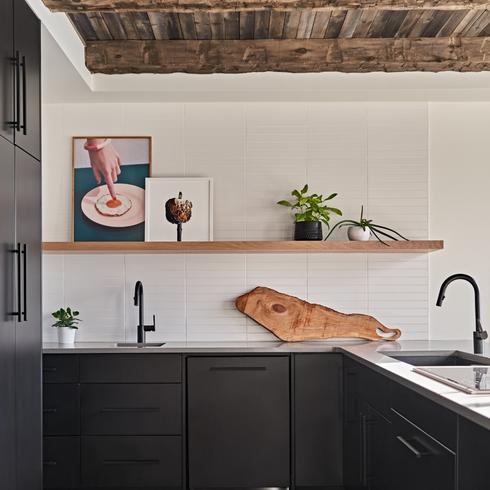 Artwork on shelf in minimalistic kitchen