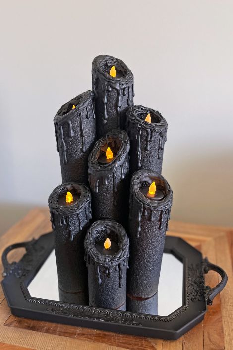 halloween centrepiece decorated with spray paint and decorative candle lights
