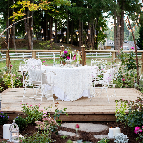 The outdoor garden dining table in Pamela Anderson's rose garden