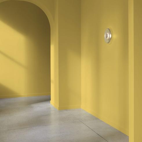 Arched hallway painted savannah green as one of the picks for a 2023 paint colousr of the year