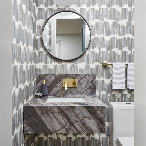 Grey powder room with mixed patterns