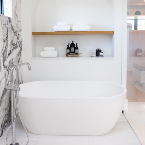 Large soaker tub and built in bathroom storage