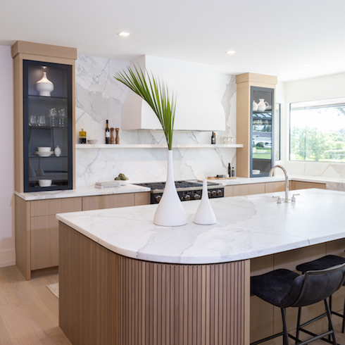 Wood and white kitchen with giant island