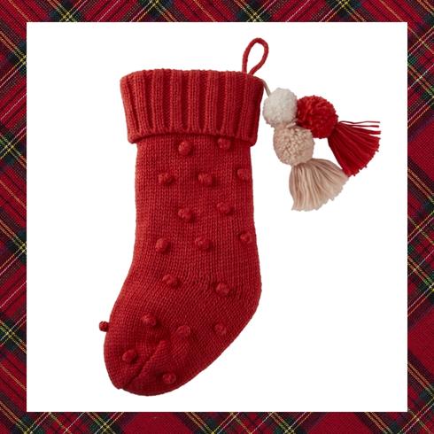 Red stocking with pom poms