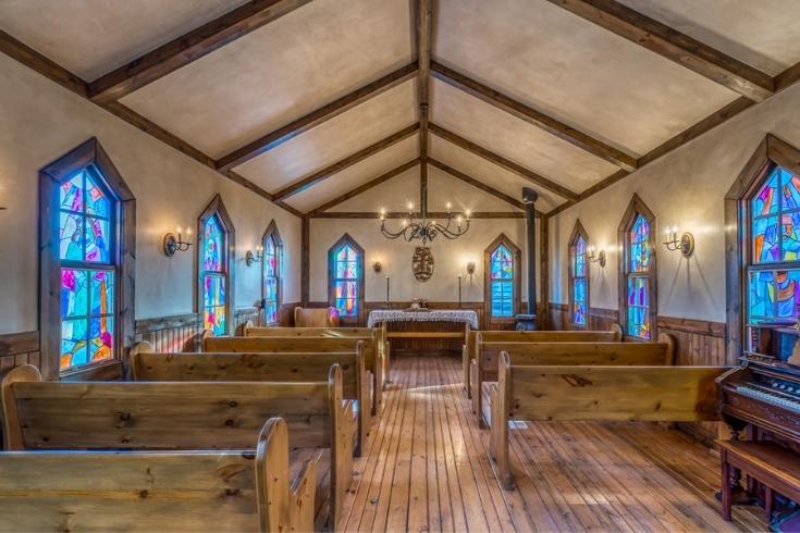 the interiors of a chapel in a luxury ranch