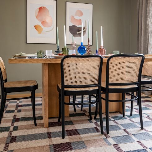 Dining room table with dining chairs and wall art