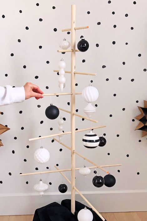 Wooden dowel tree wth black and white ornaments 
