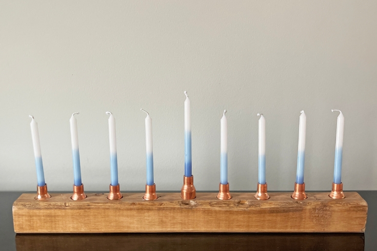 DIY menorah with blue and white candles 