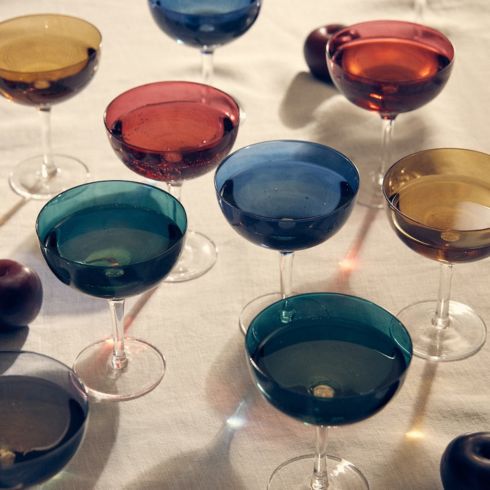 Colourful coupe glasses for the table