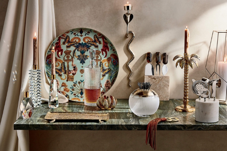 Maximalist tablescape with colorful tray and candle sticks