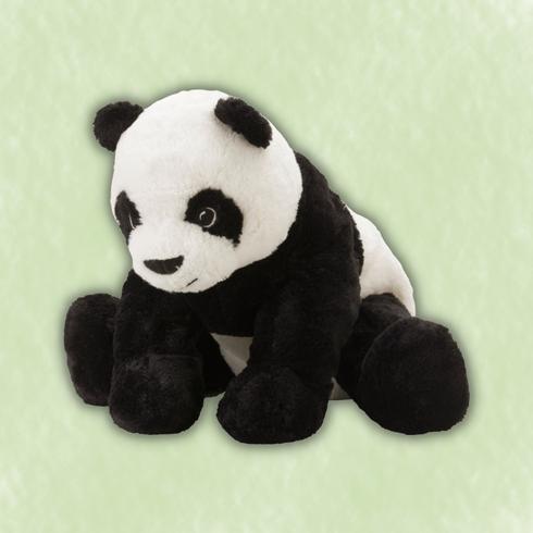 A toy panda in a green background from IKEA