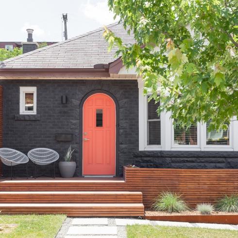 Home painted black with a red door