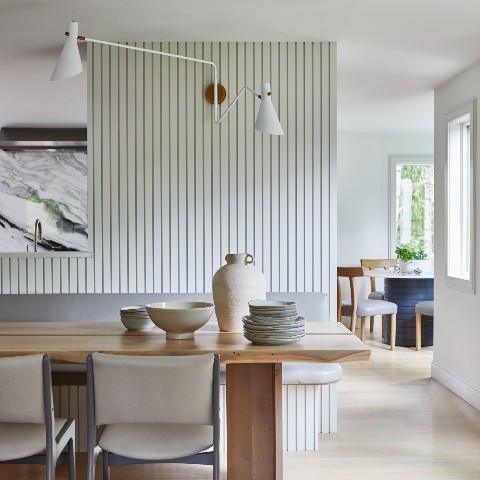 Dining room with paneled wall