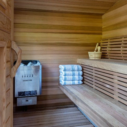 Sauna with blue striped towels