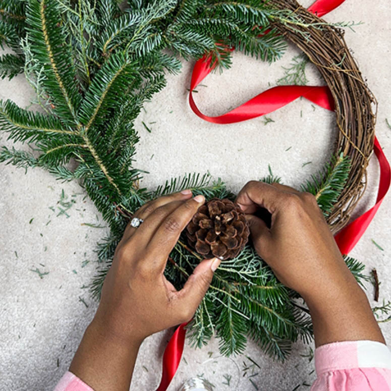 Person making a wreath