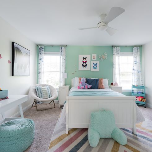 Kid's bedroom with teal wall
