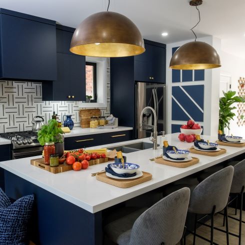 Kitchen with dark blue cabinets and patterned accents