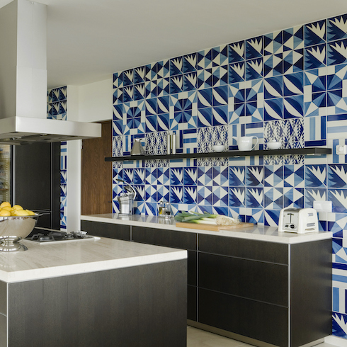 Modernist new build kitchen with bold blue backsplash tiles in the south of Spain designed by Matteo Thun