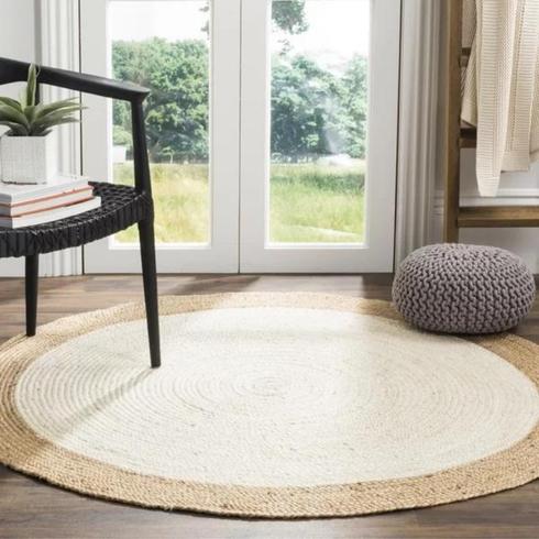 Round white jute rug in living room