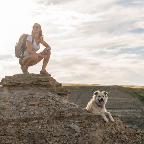 Woman in the Badlands with her dog