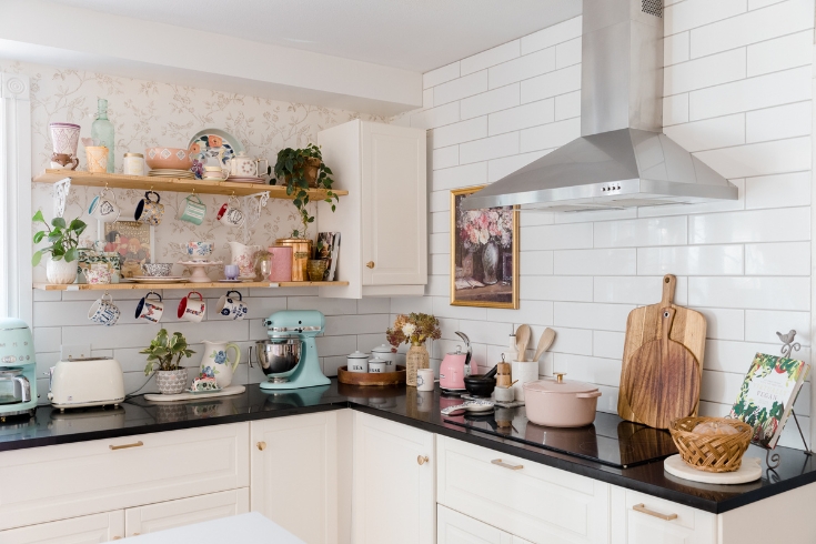 Pastel-coloured kitchen accessories in a white kitchen.