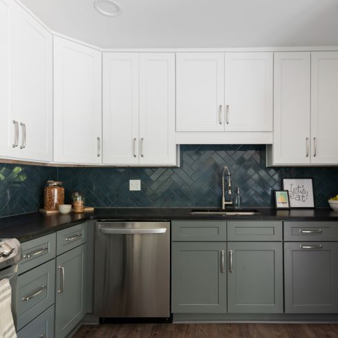 Two-tone kitchen cabinets with darker lower and lighter uppers