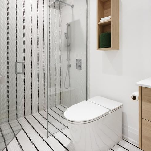 Striped shower tiles in walk-in spa-worthy bathroom
