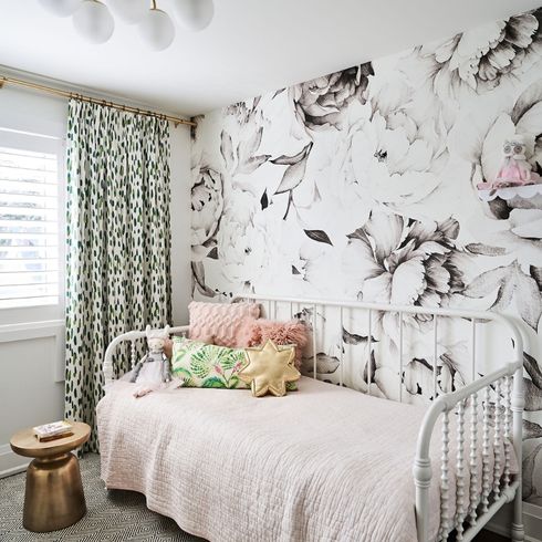 Pretty wallpapered kid's bedroom with daybed