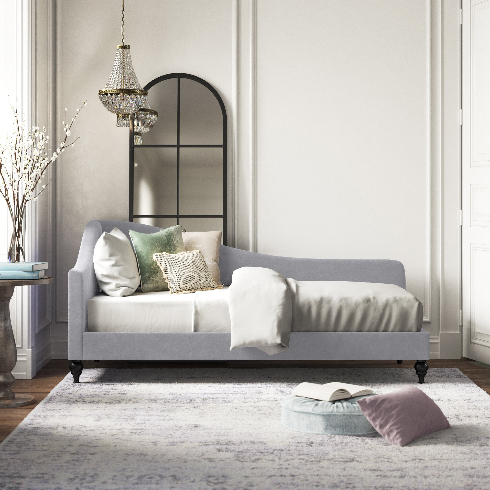 A shot of the Landis Upholstered Daybed in a glamorous modern living room