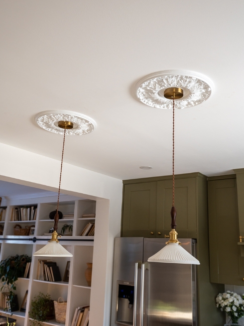 Two kitchen pendant lights with high gloss white mouldings