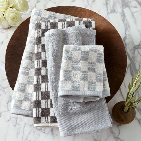 Three towels in a geometric pattern