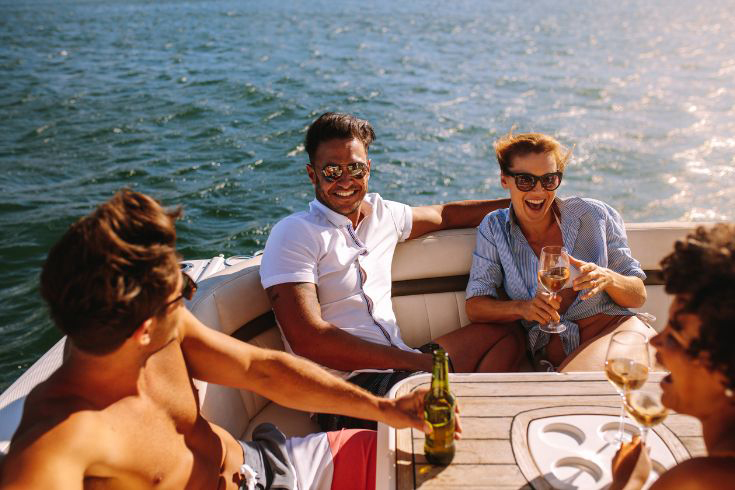 Friends on a boat drinking wine