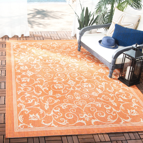 A terracotta coloured area rug