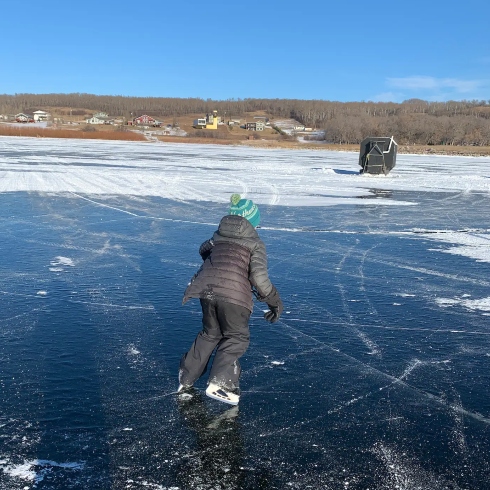 Skating on frozen lake in Manitoba
