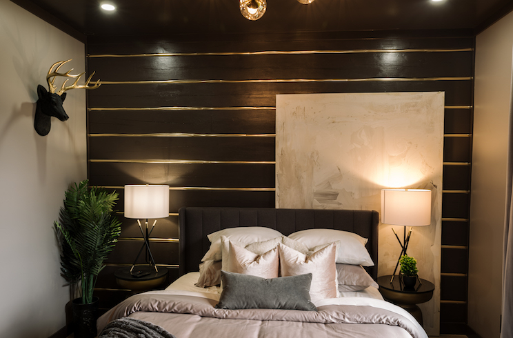 A Black and gold feature wall in Cabin 2 from Renovation Resort