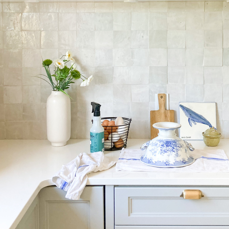 kitchen towels and bowl on white countertops