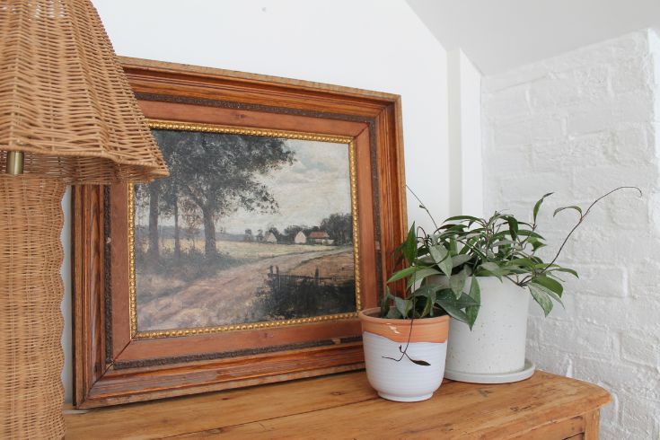 antique-looking art print in antique frame