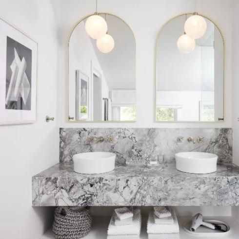 Bathroom renovation trend of a minimalist bathroom with marble counter